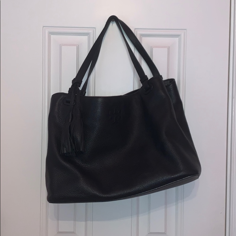 Black medium leather tote bag with tassel